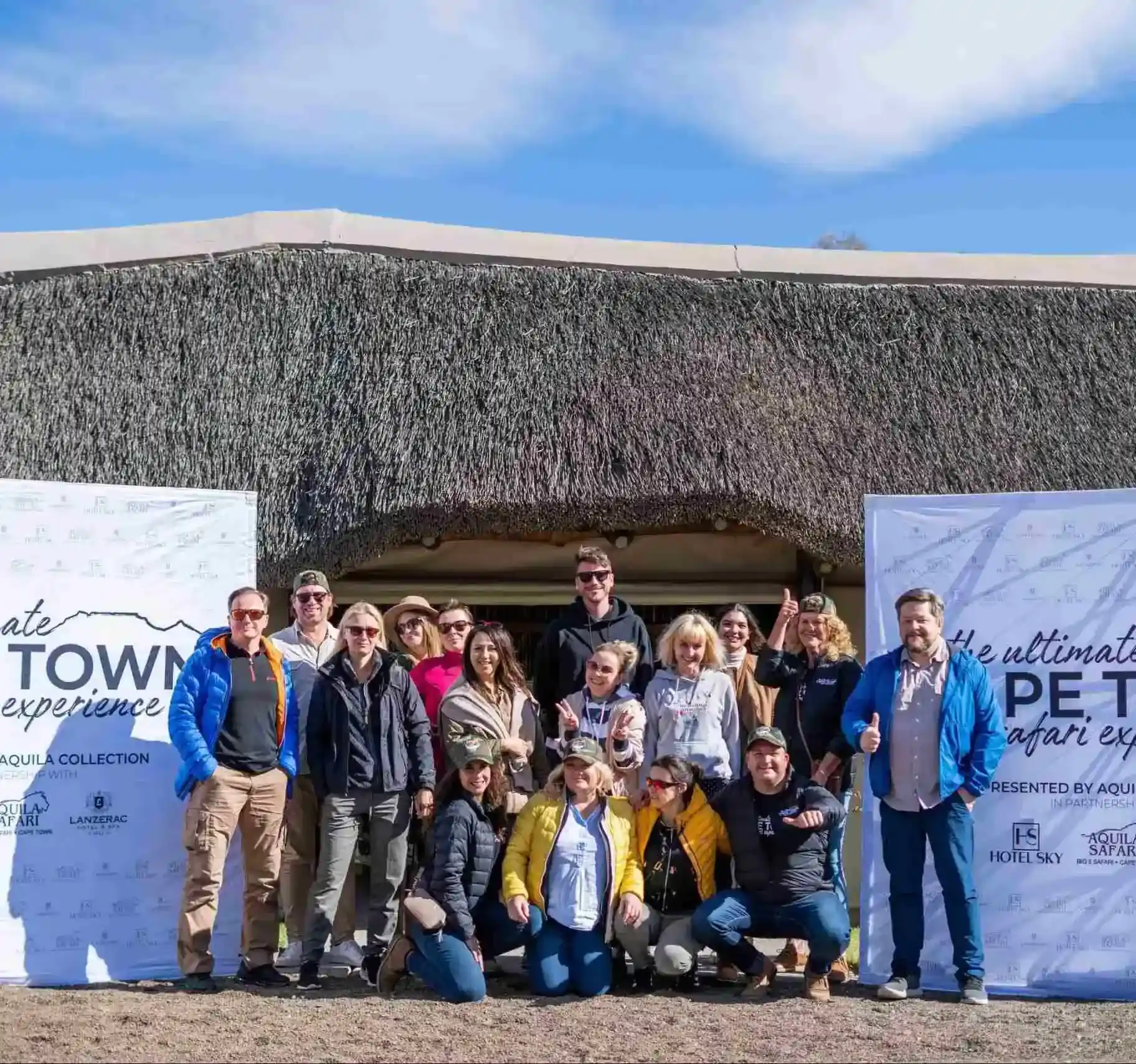 Past Experiences: Group of Polish media and tourism representatives in front of the Ultimate Cape Town Safari Experience banner